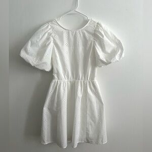 White floral cut out puff sleeves mini babydoll dress. New w/o tags